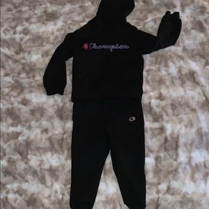 Kids black champion sweat outfit.